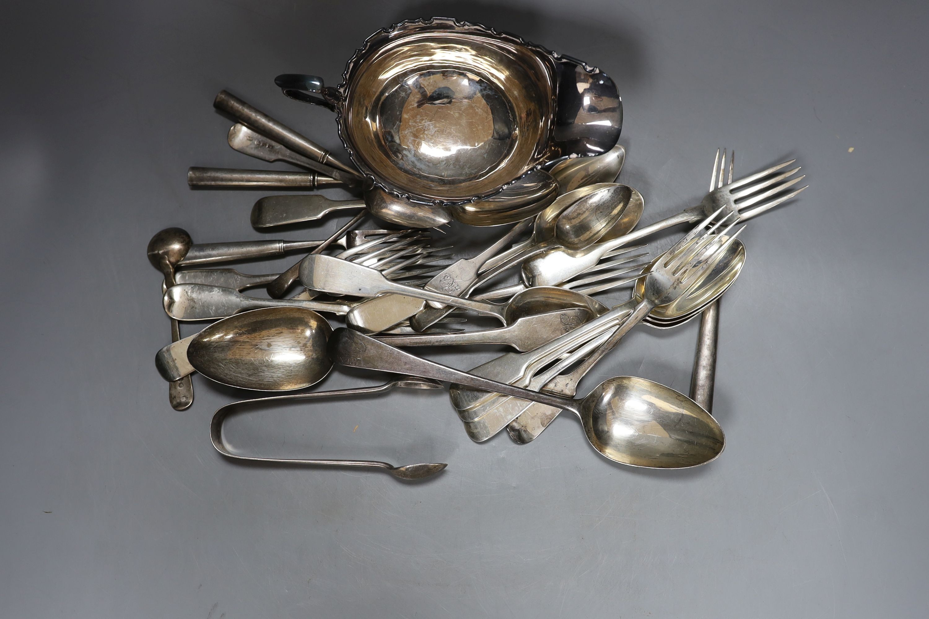 A George V silver sauceboat and a small quantity of assorted mainly 19th century and later silver flatware, 30.5oz and four French white metal tea forks.